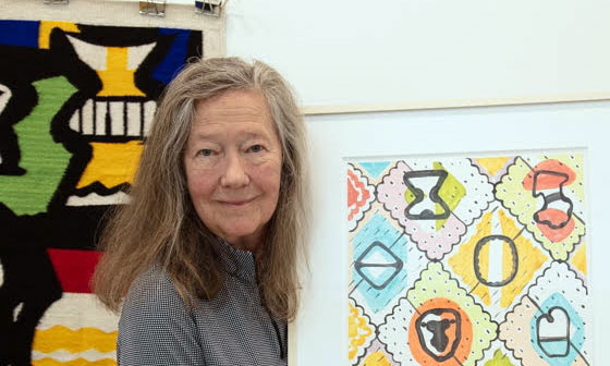 Holly-Hughes-with-her-art
